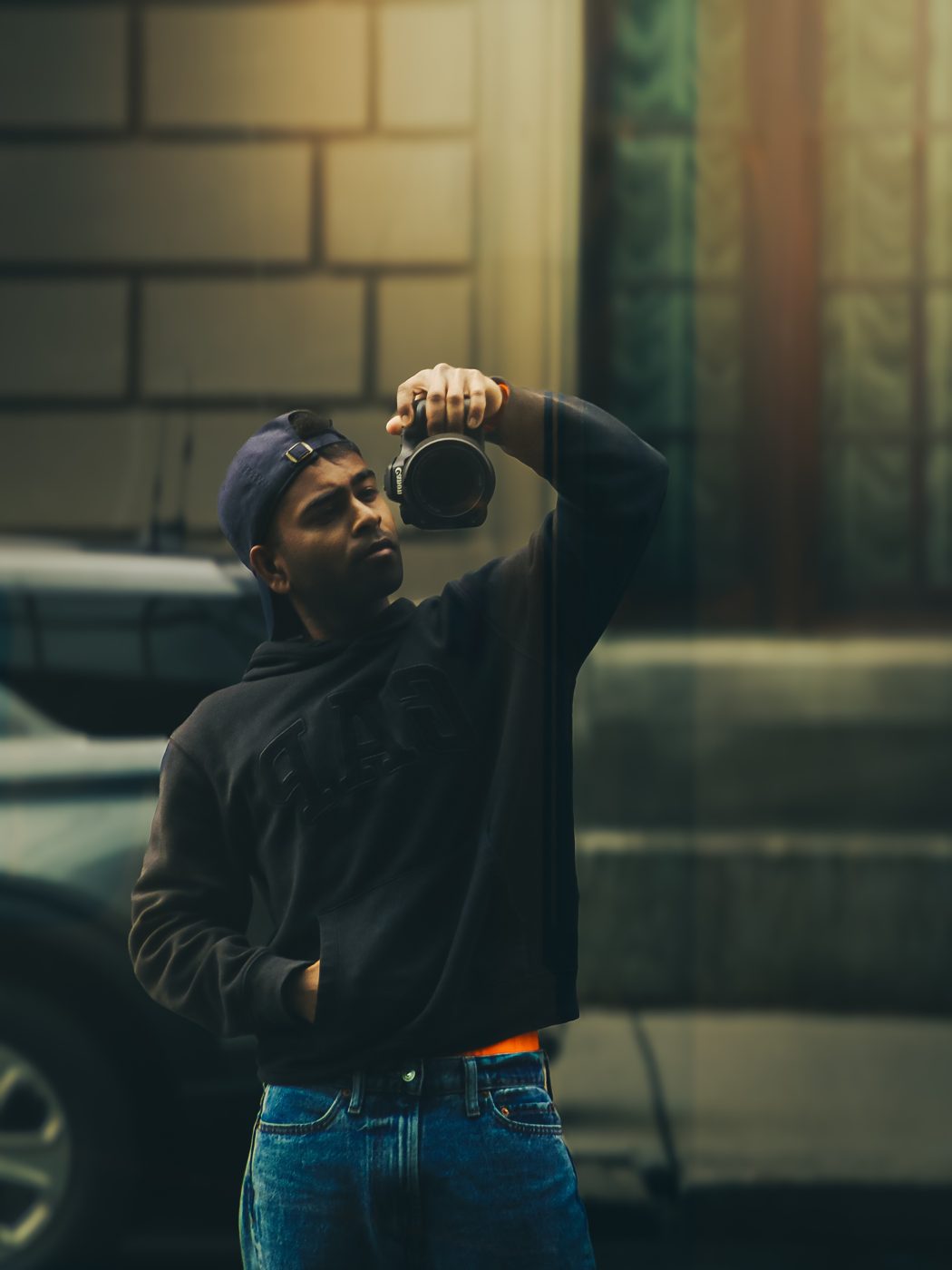 Portrait holding a camera